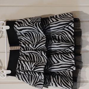 Girls zebra print skirt with elastic waist.